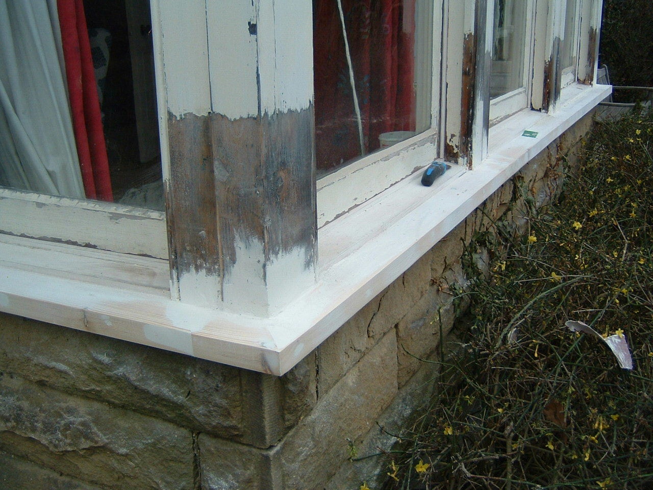 New timber window sill fitted during casement restoration