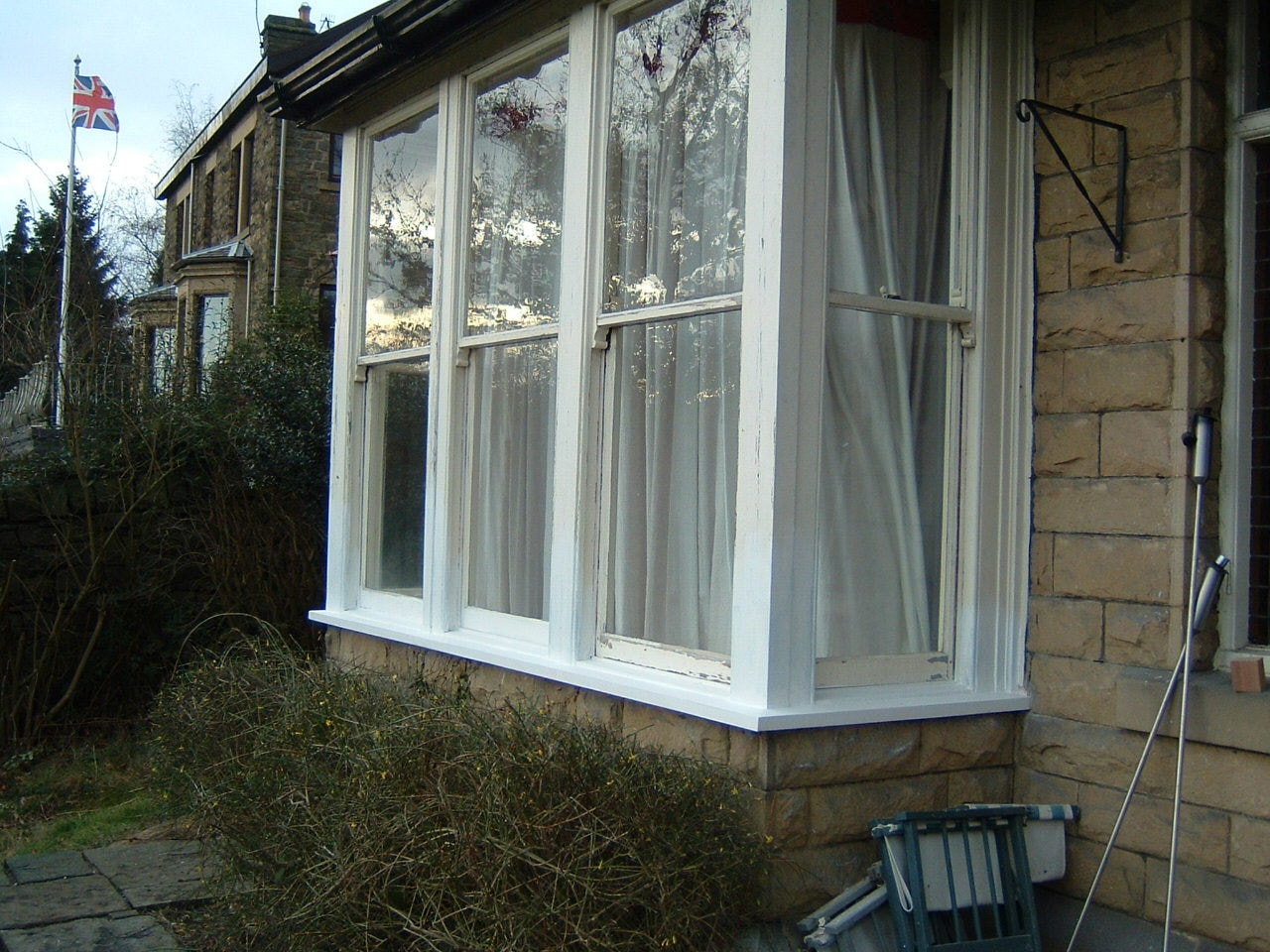 Restored casement windows on a period stone property